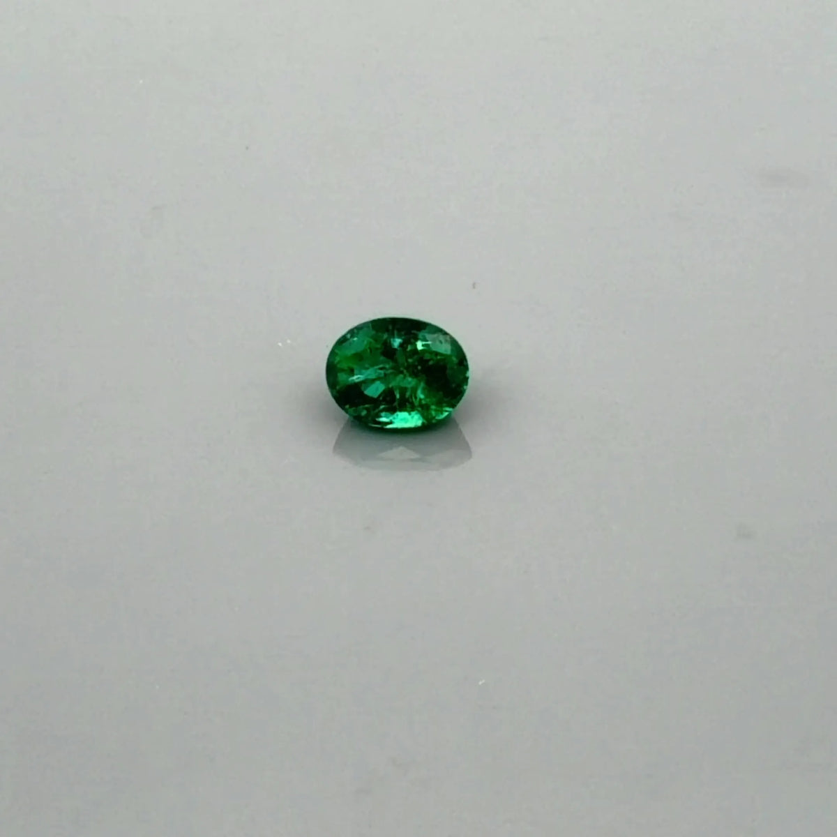 0.64ct Oval Natural Emerald (Colour Green, Clarity Slightly Included, Cut Faceted)