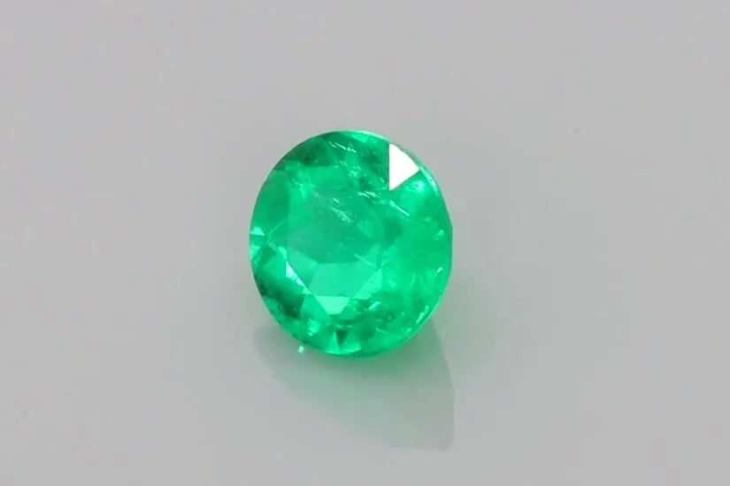 0.54ct Round Natural Emerald (Colour Green, Clarity Slightly Included, Cut Faceted)