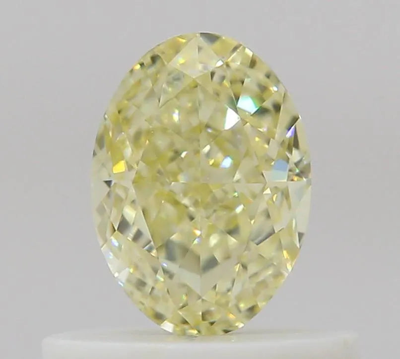 0.56ct Oval Natural Diamond (Colour Fancy Light Yellow, Clarity VVS1, GIA Certified)