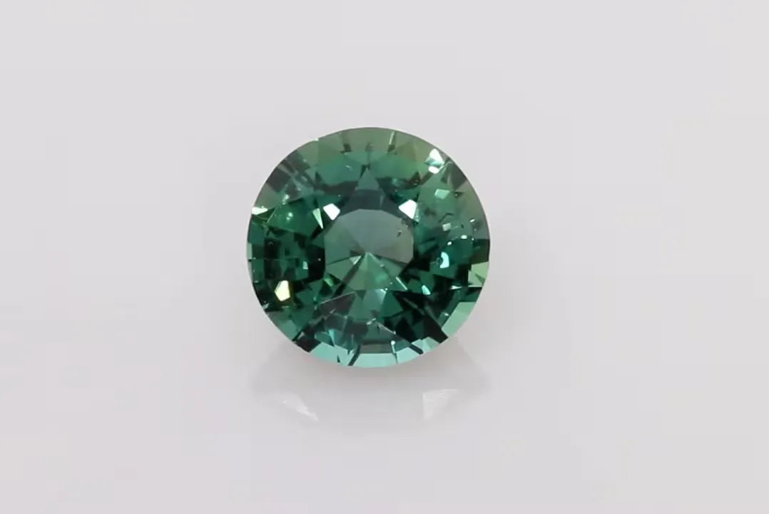 1.39ct Round Natural Sapphire (Colour Multicolor, Clarity Slightly Included, Cut Faceted)