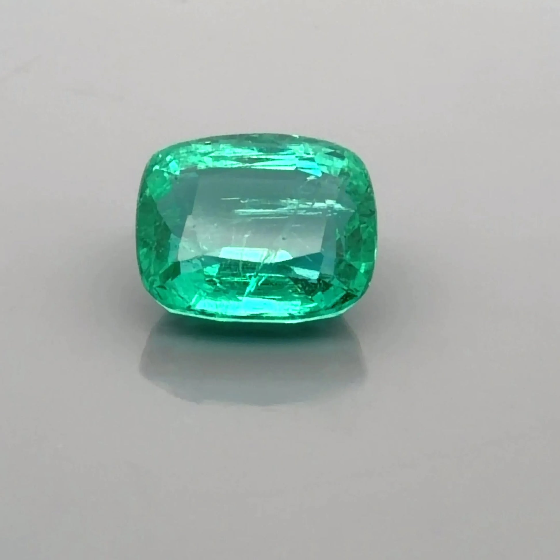 4.41ct Cushion Natural Emerald (Colour Green, Clarity Moderately Included, Cut Faceted)